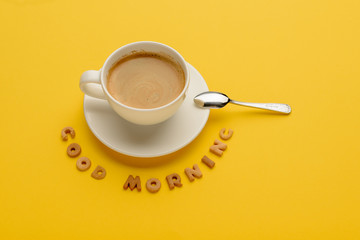 Close-up view of cup of fresh hot coffee and good morning inscription