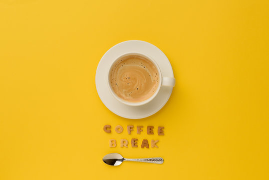 top view of cup of espresso coffee, spoon and coffee break lettering