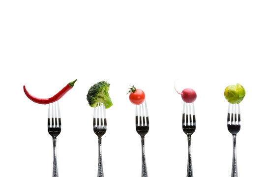 fresh vegetables on forks isolated on white, healthy living concept © LIGHTFIELD STUDIOS