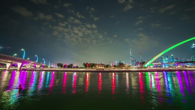 night light dubai canal reflection downtown crossing bridge panorama 4k time lapse uae
