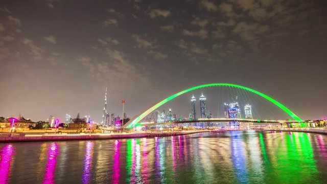 dubai water canal night illuminated crossing bridge downtown panorama 4k time lapse uae

