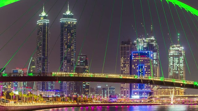 night dubai water canal crossing bridge downtown panorama 4k time lapse uae
