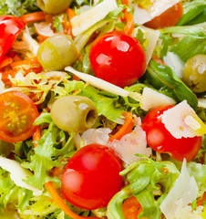 Mixed salad on black slate.