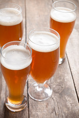 glass beer on wood background