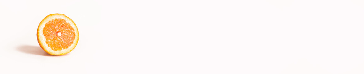 Bright and Fresh Single Orange slice in a Panoramic Image For Skinali.