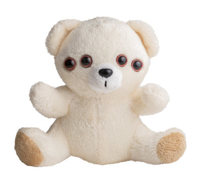 Weird teddy bear, four eyes. Nightmare and fears metaphor