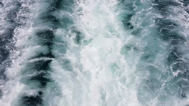 Water trail foaming behind a ferry boat in Ionian sea, Corfu Island, Greece, Europe.