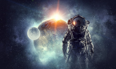 Obraz na płótnie Canvas Astronaut in outer space. Mixed media