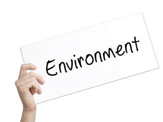 Environment Sign on white paper. Man Hand Holding Paper with text. Isolated on white background