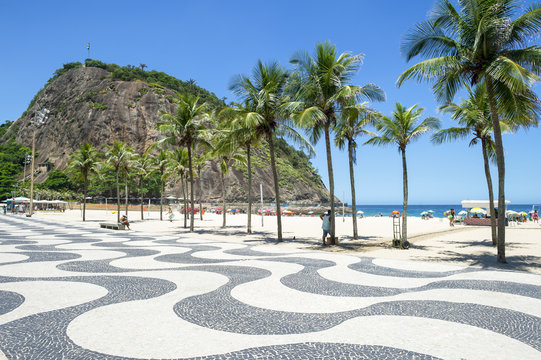 Scenic landscape view of Copacabana Beach from the palm tree-lined boardwalk