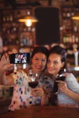 Young women taking a selfie from mobile phone 