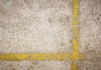 yellow line paint on gray concrete floor background