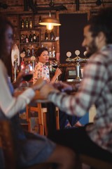 Jealous woman looking at couple flirting with each other