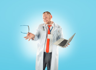 Portrait of young handsome happy male doctor.