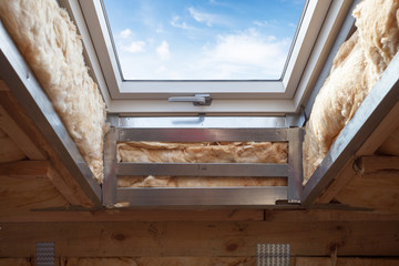 Plastic (mansard) or skylight window on attic with environmentally friendly and energy efficient...