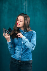 Young beautiful Girl with retro camera