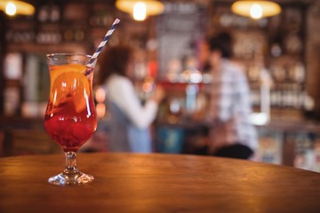 Close-up of cocktail drink served on table