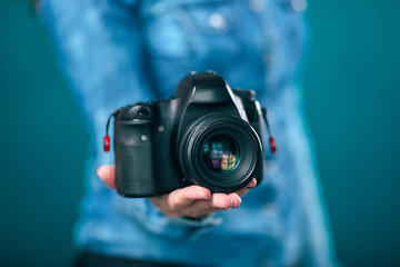 Young beautiful Girl with retro camera
