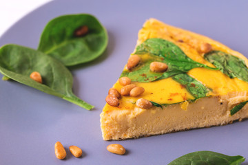frittata with eggs, spinach, cheese and pine nuts