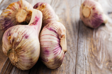 Garlic bulbs on wooden table