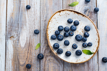 Fototapeta na wymiar Fresh blueberry on wooden table