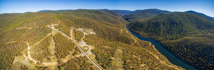 Aerial panorama of Snowy River and Hydro Surge Tower near Mount Kosciuszko National Park, Australia