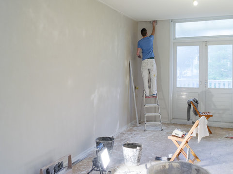 a plasterer working in a house
