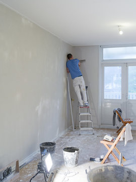 a plasterer working in a house