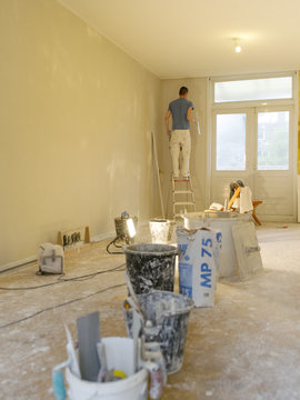 a plasterer working in a house