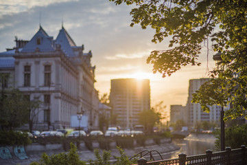 Fototapeta na wymiar Bucharest city center at sunset - Justic Palace and Dimbovita river.