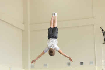 GOMEL, BELARUS - 22 April 2017: Freestyle competitions among young men and women in 2004-2006. In the program trampoline and gymnastic path
