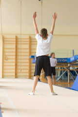 Fototapeta na wymiar GOMEL, BELARUS - 22 April 2017: Freestyle competitions among young men and women in 2004-2006. In the program trampoline and gymnastic path