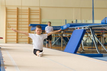 GOMEL, BELARUS - 22 April 2017: Freestyle competitions among young men and women in 2004-2006. In the program trampoline and gymnastic path © makam1969