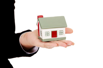 Business woman holding a house model