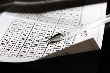 A pen and a numbered leaf, a riddle or a rebus