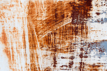 A background of peeling paint and rusty old metal