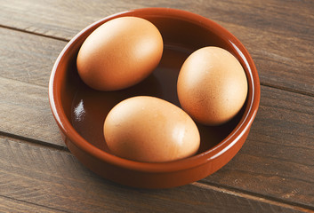 Eggs on wooden table. Horizontal shoot.