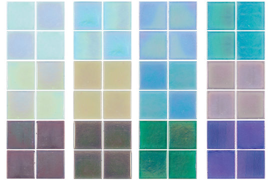 Set of multicolored iridescent ceramic tiles on white background