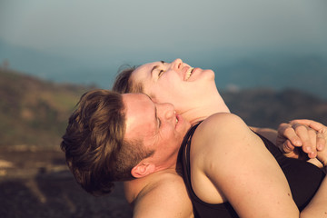 Fototapeta premium Loving couple on top of a mountain.