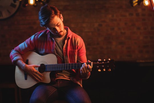 Young man playing guitar 