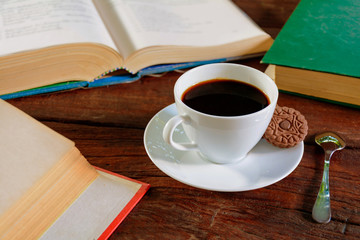 coffee cup and book on old wood