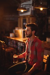 Thoughtful man having beer