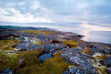 Teriberka, Kola Peninsula, Russia. Sunset on the Barents Sea, Arctic Ocean.