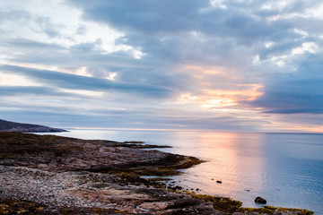 Fototapeta na wymiar Teriberka, Kola Peninsula, Russia. Sunset on the Barents Sea, Arctic Ocean.