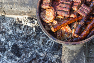 Barbecue - grilled meat in big clay bowl