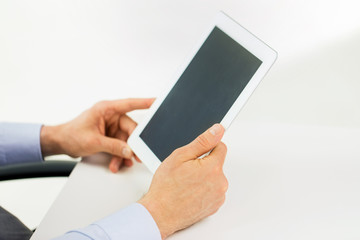 businessman hands with tablet pc at office