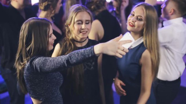 girl take selfie in a nightclub