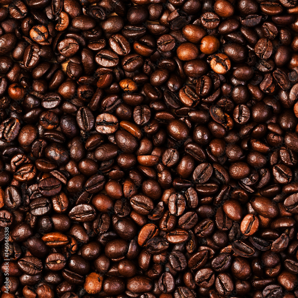 Poster coffee beans background macro. dark roasted coffee beans textured wallpaper for your design with cop