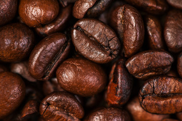 Coffee beans macro on a brown background