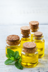 Organic essential oil with green mint leaves, spa concept